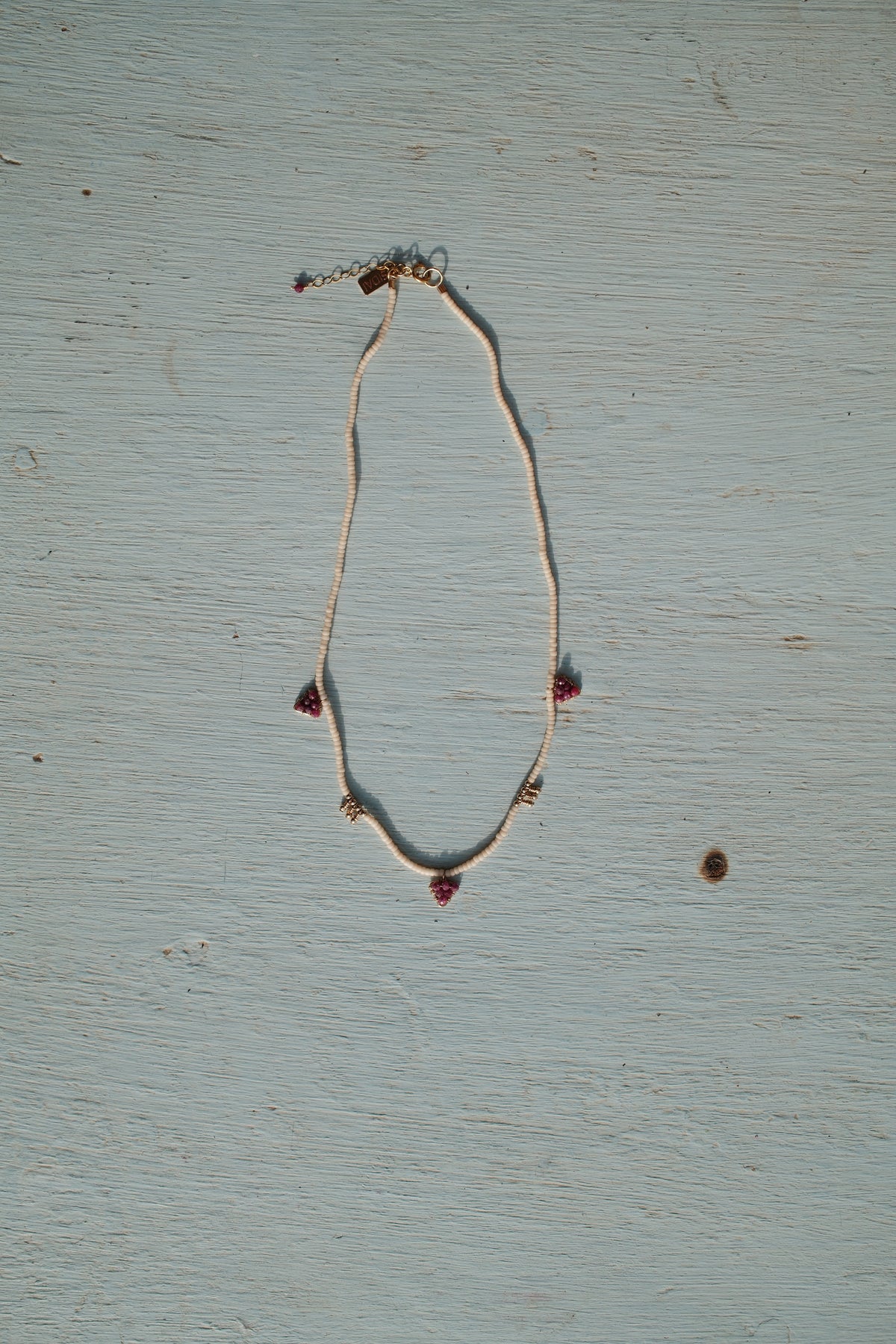 Beaded Necklace with Gold Blocks and 3 Triangles